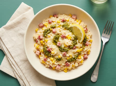 Bacon and pesto baked risotto with sweetcorn and lemon