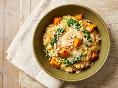 Baked pumpkin risotto with parmesan and baby spinach