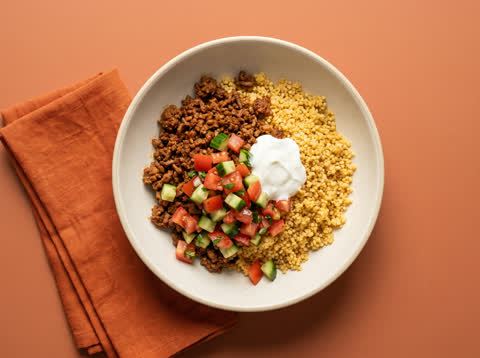 BBQ-spiced beef bowl with garlic couscous