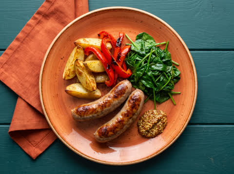 Pork sausage and veggie traybake with baby spinach