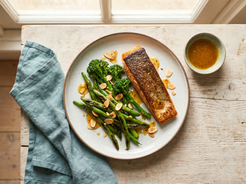 Seared salmon with mustard-honey greens and toasted almonds